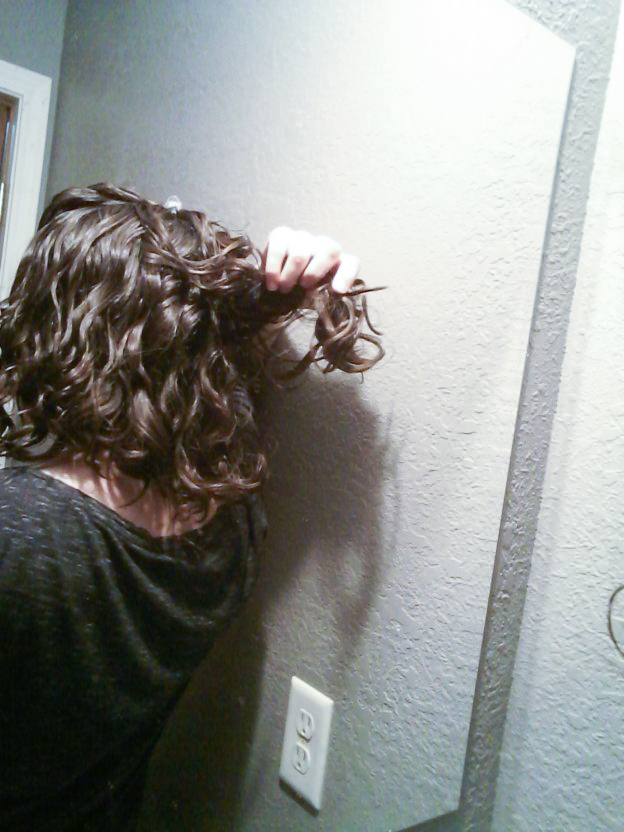 Hair in back of head is curlier than the front